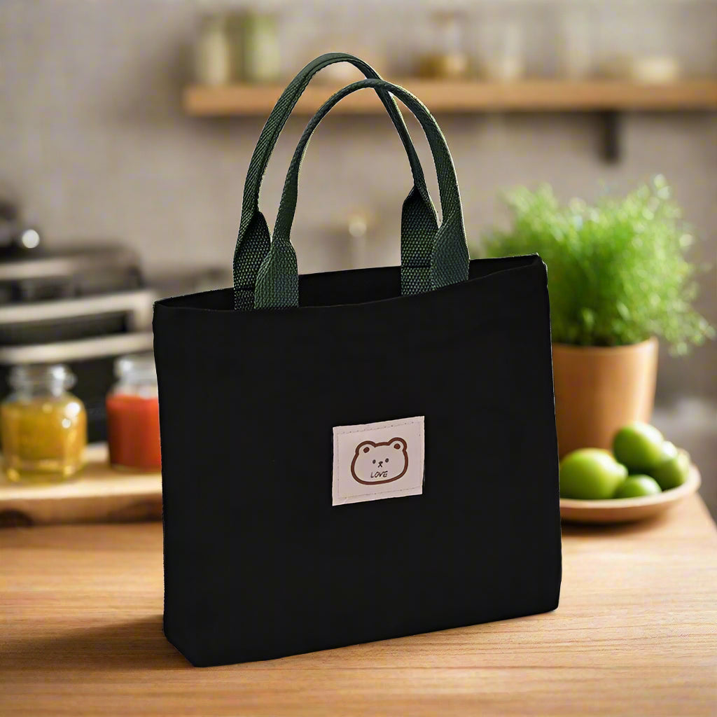 Black  canvas bag with green straps